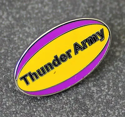 Rugby ball-shaped Thunder Army cloisonné pin badge in yellow and purple