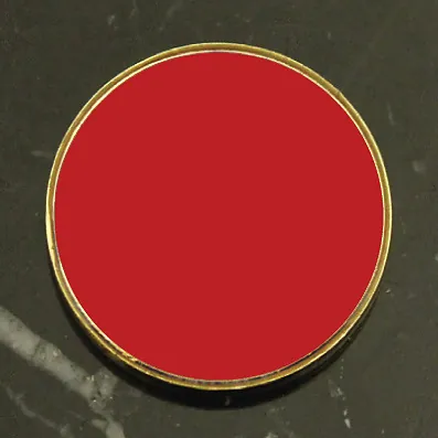 Plain red round enamel school badge with gold edge